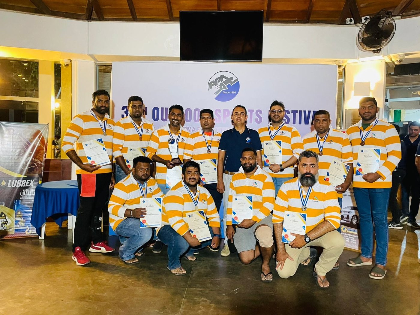 Team in custom L & T rugby jerseys at the Outdoor Sports Festival